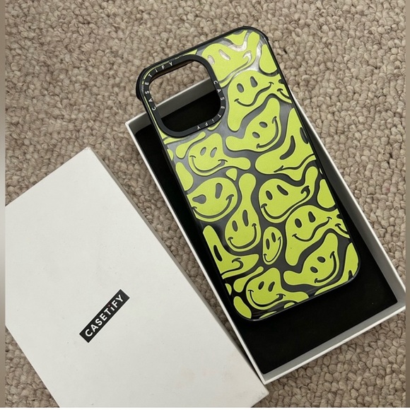 CASEIFY green smiley face case for an IPHONE 14 PRO MAX